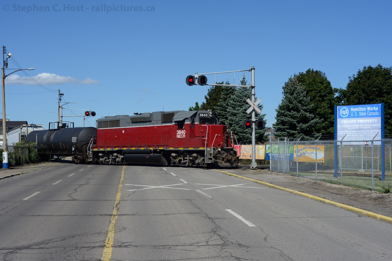 NECR 3840 is switching the Railcare yard at Wilcox St - which is a US Steel (Stelco) maintained road and railway crossing and the main plant entrance for workers.