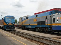 VIA 913 and train 42 sits outside the station at Smiths Falls, while VIA 45 with 901 rolls through town.