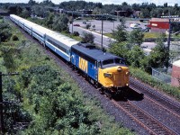 Leased VIA FP9 6302, leads AMT train 22 towards Beaconsfield on a warm August morning.