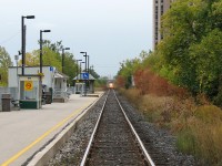 Motoring northbound in the late morning, VIA train 85 with F40PH-2 6427's faded yellow nose in the lead bears down on John Street crossing in the community of Weston. 15 minutes out of Toronto Union Station, 85 won't be stopping at the platforms of the GO train-only Weston Station pictured.
<br><br>
Today, the site where this station is is just a big hole in the ground: all the structures have since been demolished (including the former CN waiting room building dating to pre-GO days), a new station has been built to the south of Lawrence Ave., the track has been temporary shifted to the CP line nearby, and a large trench occupies this site as Metrolinx continues the process of lowering the rail corridor through Weston, in preparation for the Pearson Air Rail link and more frequent Kitchener (Georgetown) line GO service through the community.