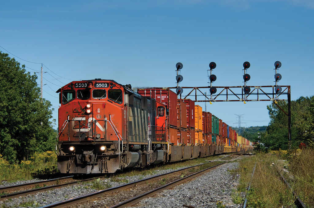 Passing through my old childhood stomping grounds, CN Q149 speeds through Clarke on the north track of CN's Kingston Sub behind a nice SD50AF.