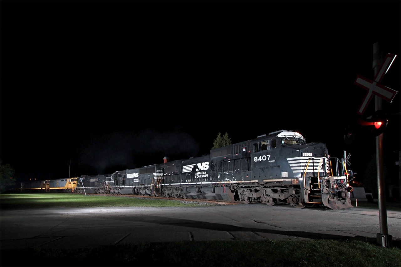 CN 328 is back on CN tracks after rolling for many years on the CP Lacolle sub. Hitching along are three ex-QNSL C40-8M headed to the U.S. for an overhaul. Six radio-controlled flashes where needed to light up the scene.