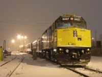 A rough looking 6407 sits under the lights in a snow storm at the Walkerville Station, in Windsor. A late #79 has not arrived yet, and is not supposed to be here for another 20+ minutes. The snow was causing more problems north of Windsor, and signal issues across the system.