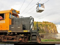 Under the cable car, TTC #622 is preparing for the departure for another day on the Charlevoix Subdivision (ex-CN Murray Bay Subdivision) in front of the Montmorency Falls.