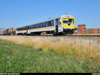 <I><B>North American VS European!</B></I> By a gorgeous afternoon, LMCX 1023 (ex-BR 628.102), an ex-germany railcar, is at only few feets of a MLW RS-18 (LMCX 1821). Beside the train and the shuttle, you can see a part of the ''Hôtel La Ferme''.
