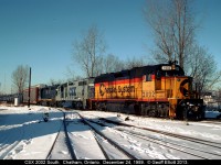 CSX's "Trains Magazine's All American Diesel" #2002 (formerly B&O 3802) leads the southbound local from Sarnia to Fargo on Christmas Eve day 1989.  With a nice mix of Chessie, CSX, and B&O for color, it was nice to catch this guy coming through town with the autorack buffer and the unmistakable Sarnia traffic behind it.  Eventhough this is "C&O country", all the units on the train today are of B&O heritage.