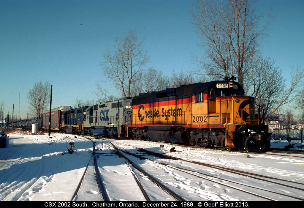 CSX's "Trains Magazine's All American Diesel" #2002 (formerly B&O 3802) leads the southbound local from Sarnia to Fargo on Christmas Eve day 1989.  With a nice mix of Chessie, CSX, and B&O for color, it was nice to catch this guy coming through town with the autorack buffer and the unmistakable Sarnia traffic behind it.  Eventhough this is "C&O country", all the units on the train today are of B&O heritage.