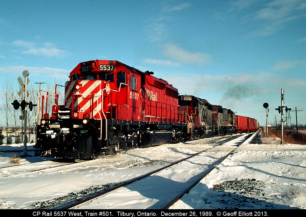 CP 5537 leads train #501, with a pair of SOO SD40-2's for good measure, into the siding in Tilbury on Boxing Day 1989.