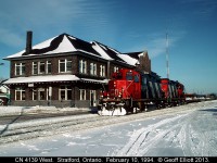 On a day where we saw the wind chill hit -35F, a pair of rebuilt geeps lead the local past the old CN Stratford station.  It's February 10, 1994 and we're waiting on the GEXR train from Goderich, with CB&CNS C630 #2035 on the point, to arrive at the junction to yard it's train.