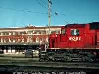CP 6061 West awaits a crew change in front of the old Canadian Pacific depot in Thunder Bay (Port Arthur), Ontario back on May 5, 2001.  In 1980, when I was 12 years old, I stood on the platform here with my mother and grandmother as we headed eastward toward home after taking a 2 week long trip across Canada by rail.  I remember we had a CP F on the point, with a CP Geep, and an early VIA F for power on this leg of the trip.  Never thought I'd ever be back in Thunder Bay, especially for work.