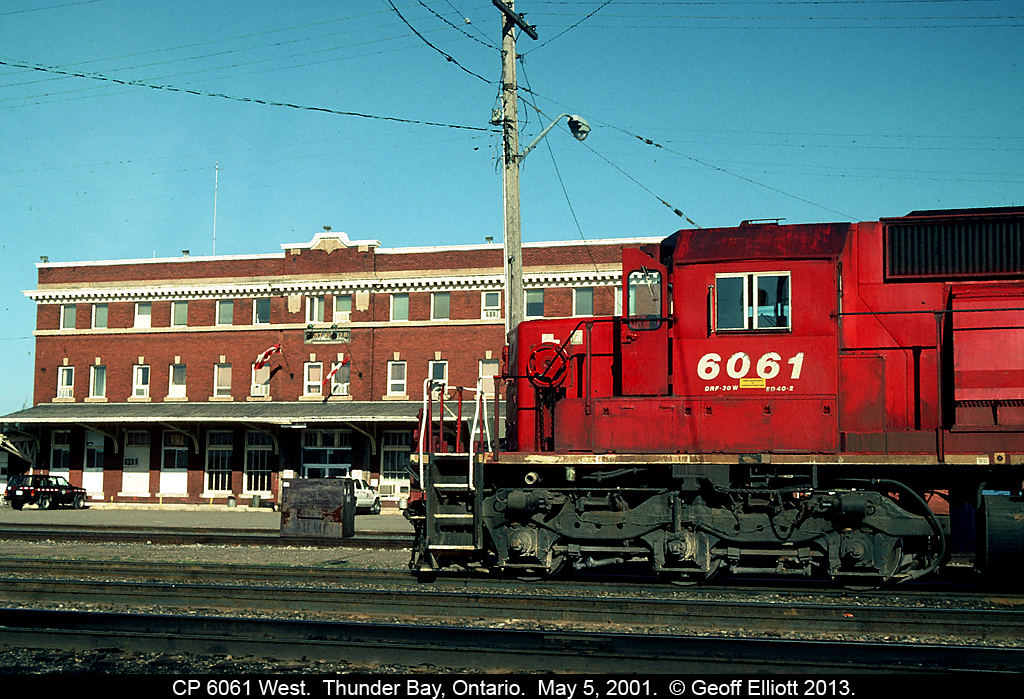 CP 6061 West awaits a crew change in front of the old Canadian Pacific depot in Thunder Bay (Port Arthur), Ontario back on May 5, 2001.  In 1980, when I was 12 years old, I stood on the platform here with my mother and grandmother as we headed eastward toward home after taking a 2 week long trip across Canada by rail.  I remember we had a CP F on the point, with a CP Geep, and an early VIA F for power on this leg of the trip.  Never thought I'd ever be back in Thunder Bay, especially for work.