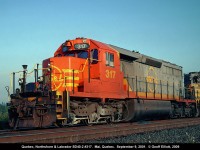 Quebec Northshore & Labrador SD40-2 #317, and sister #321, ready to depart Mai, Quebec with an 80 car loaded Arnaud ore train.  Mai is merely a crew change point on the QNS&L, with bunk houses, kitchen, etc.  We overnighted here while on a NARCOA motorcar run on the QNS&L, sleeping in bunk cars in the siding.  Mai is literally in the middle of nowhere and venturing away from the site could prove disasterous for individuals with bears and such in the area.  What I thought was interesting was the fact that I was shooting roster shots @ 6:00a.m. in the morning, being so far east and north in Quebec!!