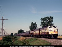 CP FP9A #1401 leads the eastbound Business Train through Jeanette's Creek, Ontario on June 5, 2004.  This was the first hit of the day as the chase ensued after.  We followed 1401 to London, then Woodstock, Guelph Jct., Hamilton, and finished the day up on the OSR.  Quite a day, and a great chase.