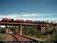 I'm standing on CN's Kinghorn sub as CP 8603 west, Train #119, crosses the Nipigon River back on June 10, 2004.  Sadly the Kinghorn has since been torn up, but we did have the opportunity to motorcar it before the rail was removed.  The CP main however still carries freight across Canada just as it was intended when built in the 1880's.