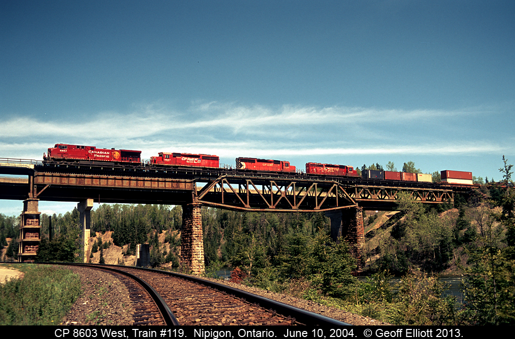I'm standing on CN's Kinghorn sub as CP 8603 west, Train #119, crosses the Nipigon River back on June 10, 2004.  Sadly the Kinghorn has since been torn up, but we did have the opportunity to motorcar it before the rail was removed.  The CP main however still carries freight across Canada just as it was intended when built in the 1880's.