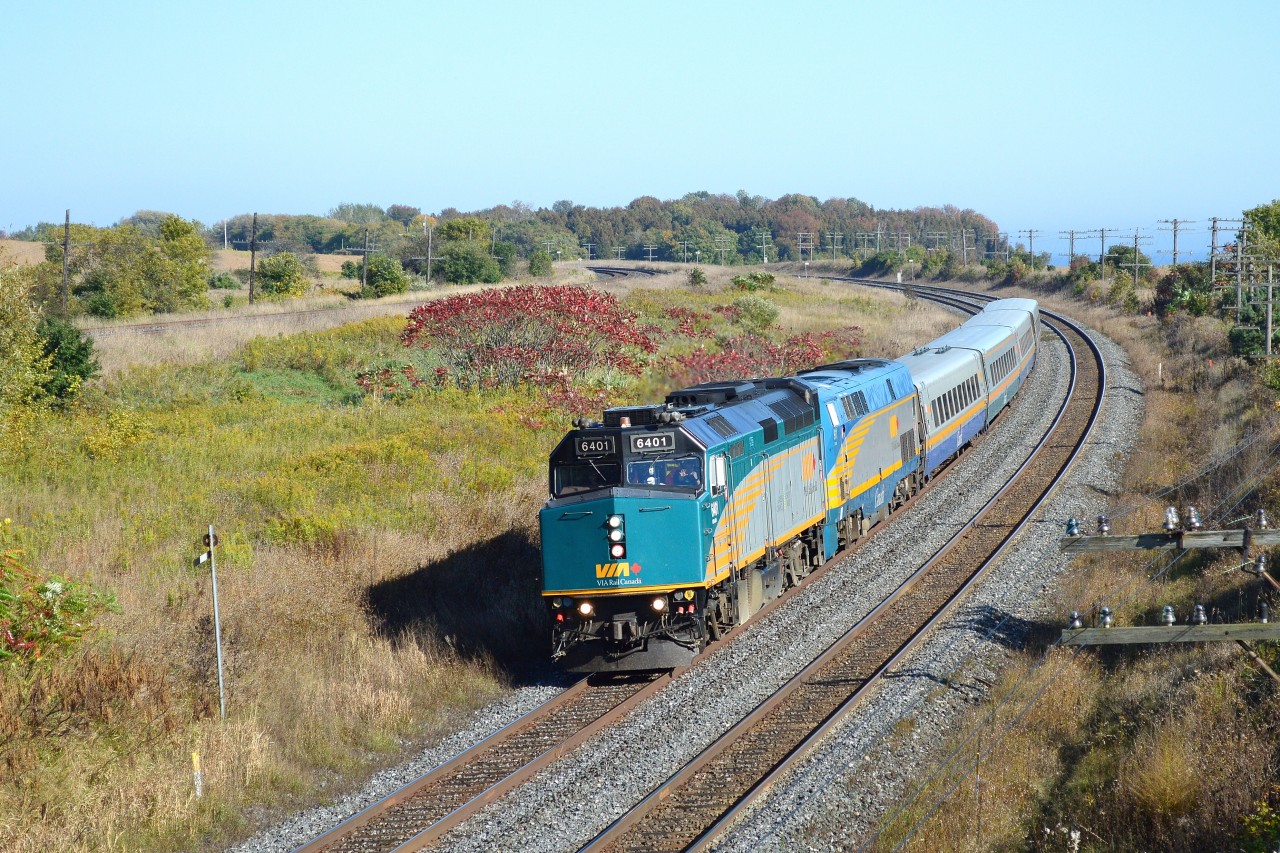A friendly wave by a Via head end crew member completes the image of an unusual Via power lashup - 1986 GMD built F40PH-2 #6401 (rebuilt 2011/2) leads 2001 GE built P42DC #911 - for Via train #61 at CN Kingston Subdivision mile 284.3; the Stephenson Road bridge. October 2, 2012 image by S. Danko.


More Stephenson Road bridge area action:


  two CP Toasters  9840 – 8919  


  The Rapido  Via CN train #63   


  THE BRIDGE !  


  THE BRIDGE – repaired !