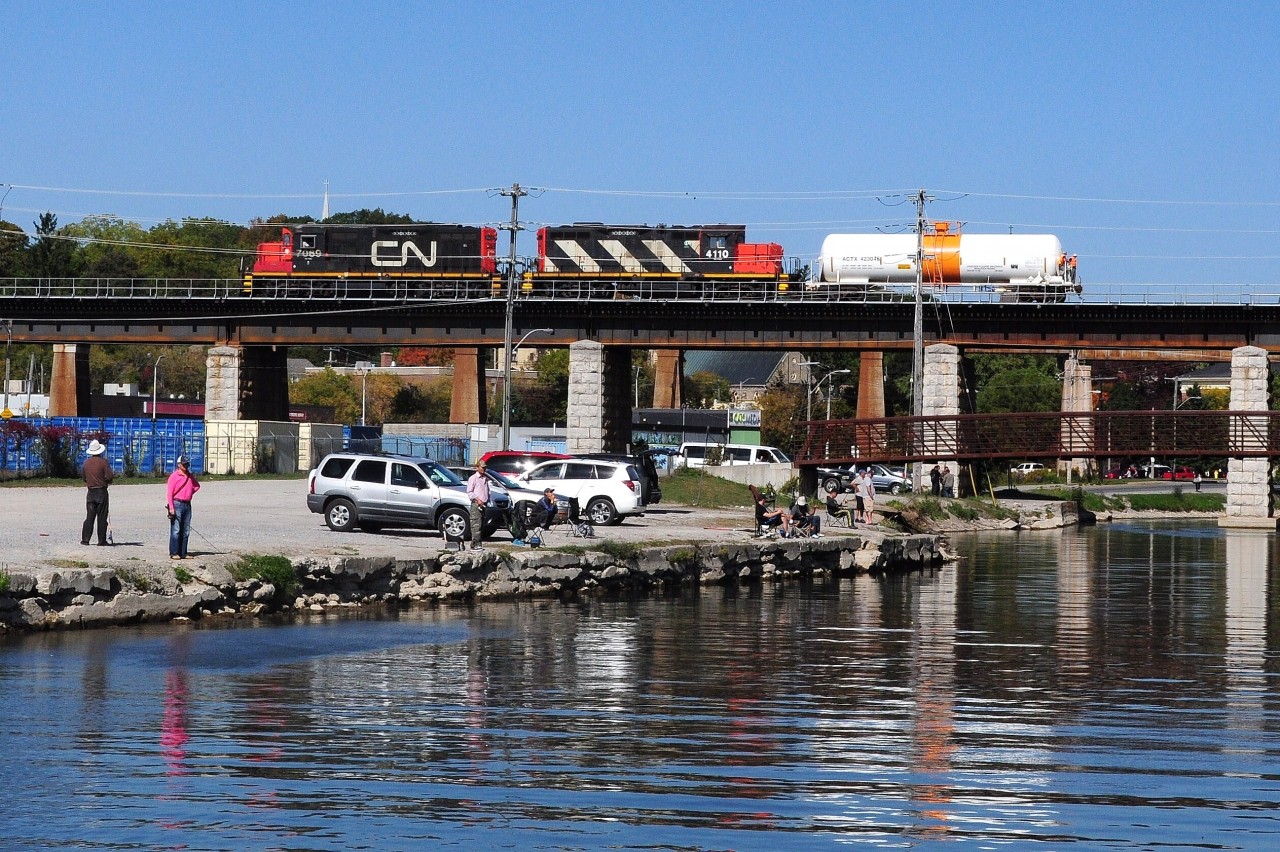 Uncommon move: After switching the Cameco plant, two CN crew members enjoy the view from the Ganaraska River Viaduct at Port Hope as CN #518, with GP9RM's 7069 (x4225, xx4607, built 1958 @ GMD for NAR) and 4110 (x4384,xx4132, built 1957 @ GMD), pushes a single tanker the 6.7 miles east to their train at Cobourg. Railroaders fear not the height! October 2, 2013 image by S.Danko.


More Port Hope:


  CN time at Port Hope