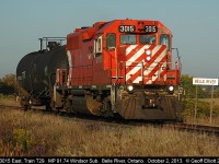 Looking like a throw back from 20 years ago the "Chatham Wayfreight", train #T29, with a classic multi-mark GP38AC, makes good time as it passes the eastern 'Belle River' mileboard.  Today T29 runs without it's regular partner, GP20C-ECO #2212, but I'm sure it can handle the workload based on only having a single tankcar in tow.