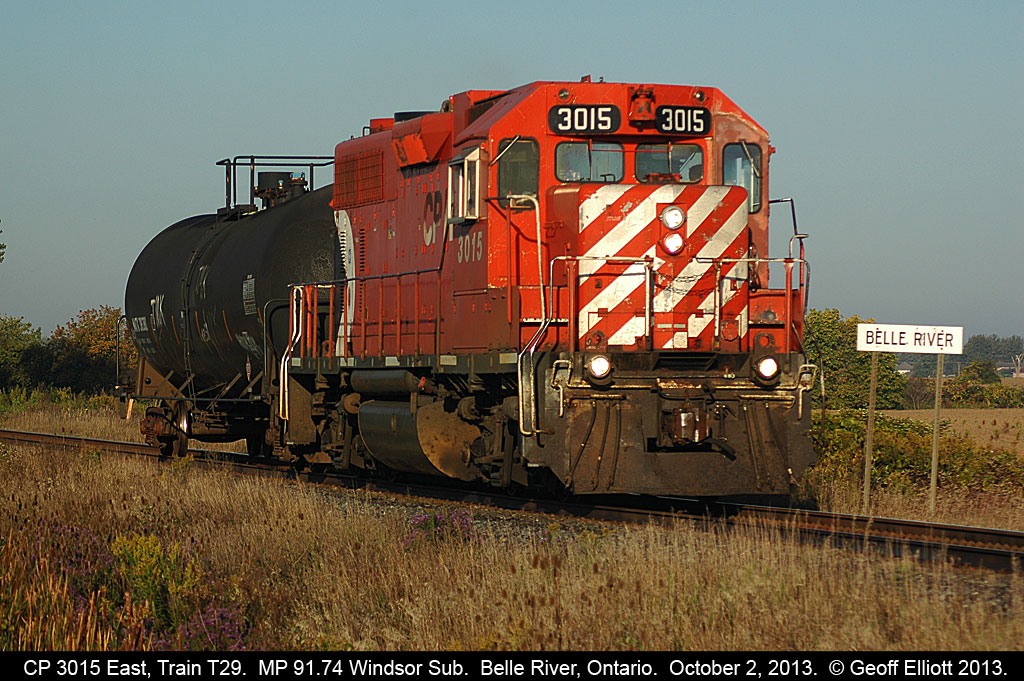 Looking like a throw back from 20 years ago the "Chatham Wayfreight", train #T29, with a classic multi-mark GP38AC, makes good time as it passes the eastern 'Belle River' mileboard.  Today T29 runs without it's regular partner, GP20C-ECO #2212, but I'm sure it can handle the workload based on only having a single tankcar in tow.