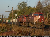 CP 240 breaks into the early morning light as it passes the east siding switch for Belle River at MP 92.8 on the Windsor Subdivision.