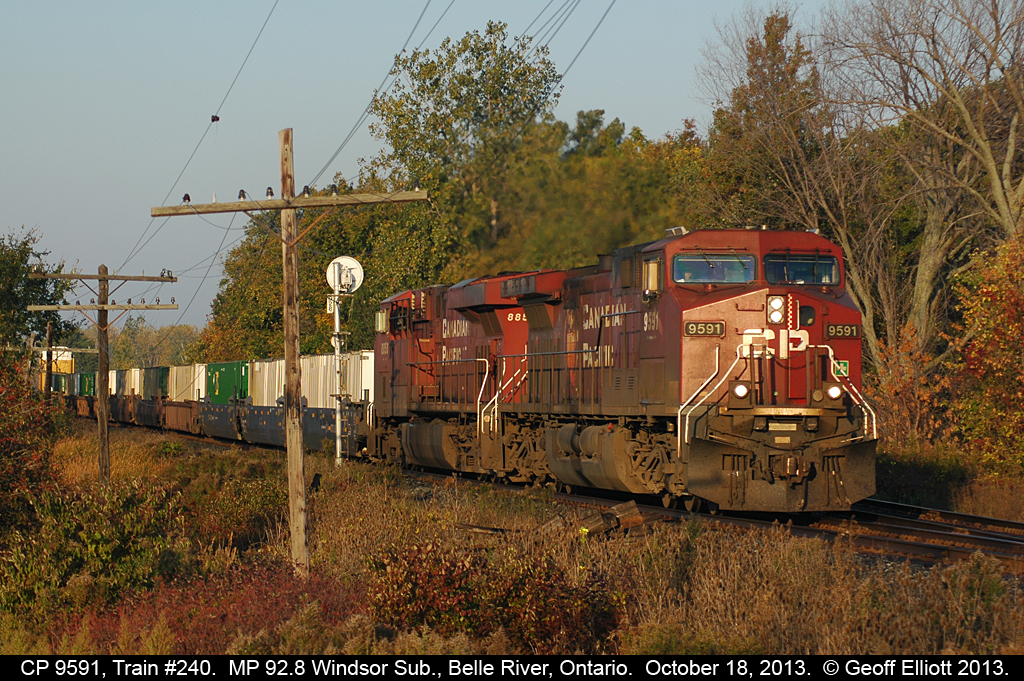 CP 240 breaks into the early morning light as it passes the east siding switch for Belle River at MP 92.8 on the Windsor Subdivision.