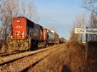 CN 438 heads SE out of Windsor through Pelton as he begins his long slow journey along the CASO to Fargo, where he will swing north onto the Sarnia sub before heading back east on the Chatham sub.