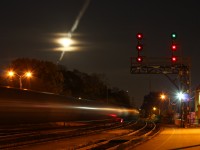 CN 8856 with 5511 and 2295 back their set off of crude cars into Brantford under the rising moon.