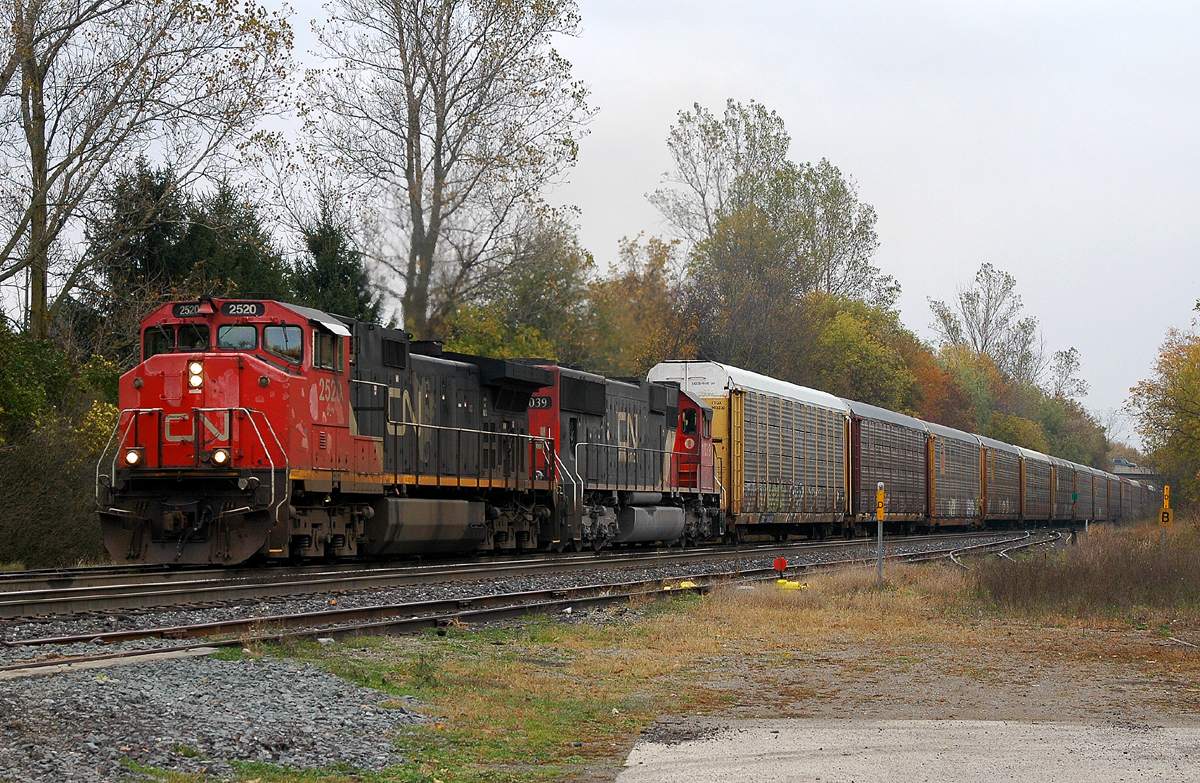 Back on the move after stalling at Mile 9, CN 393 is cresting the hill at Copetown with CN 2520 - IC 1039 leading the way, and CN 550 pushing on the rear.