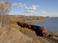 Fall color is fading fast as a Westbound passes along the shores of Lake Wabamun