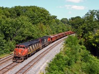 Hard to believe this is almost four years ago, we find CN's management "training train" or "scab train" westbound at Bayview. At the time, the train was running with about 80 cars IIRC, some loaded ballast cars to give the train a more accurate weight compared to regular freights and the majority of the train empty centrebeams. Most trains ran from Mac yard to Paris and return, but some later trains only ran to Bayview and back. I believe the trains ran for about two years (might have been three?), with the consist changing from time to time (later empty coil cars were used); often, there were two turns to Paris in one day, one in the morning and one in the afternoon. The trains proved their worth when CN conductors went on strike, and management kept the wheels rolling on most freights.