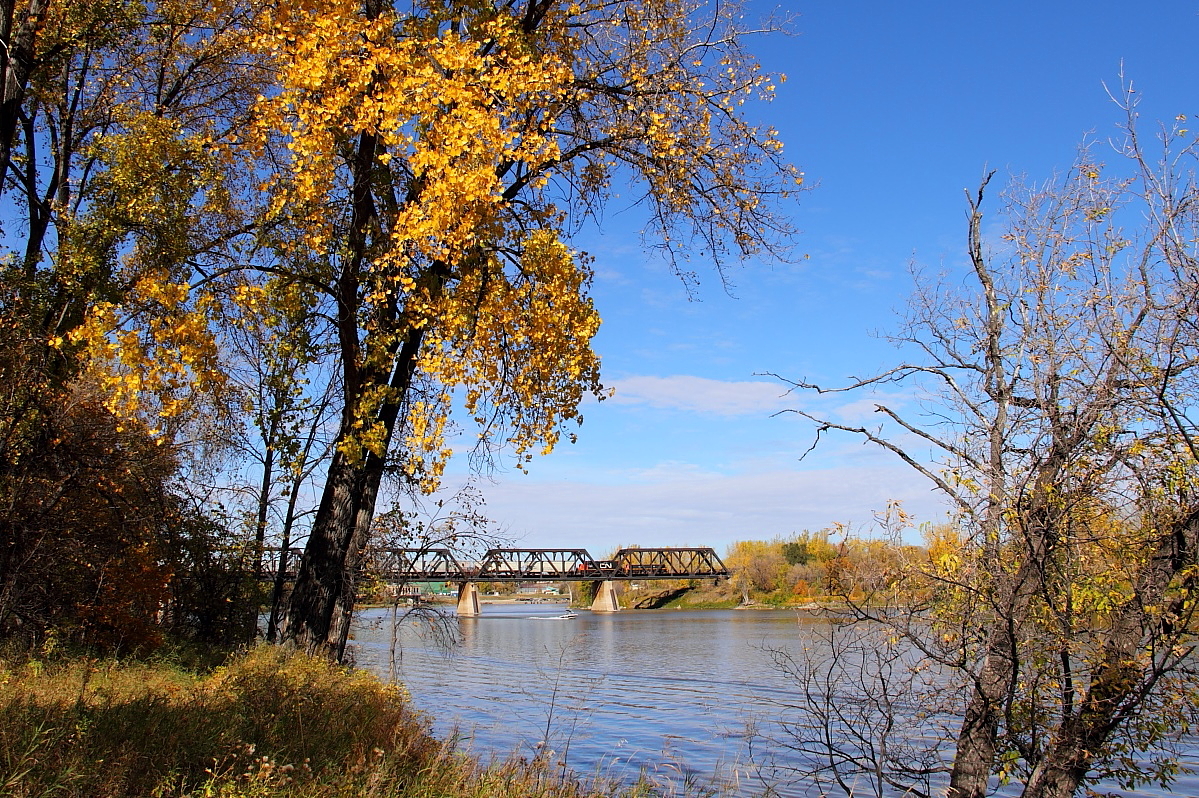 A picture perfect Fall day. A GP9 and slug lead a transfer across the Red River.