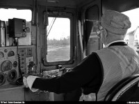 Another day on the railroad! The engineer is aware of what is happening ahead the engine. The engine, built in 1950, is an old GE 70 Ton, ex-CN 30 (1984) ; exx-CN 1530 (1956) ; nee CN 7804 (1954).