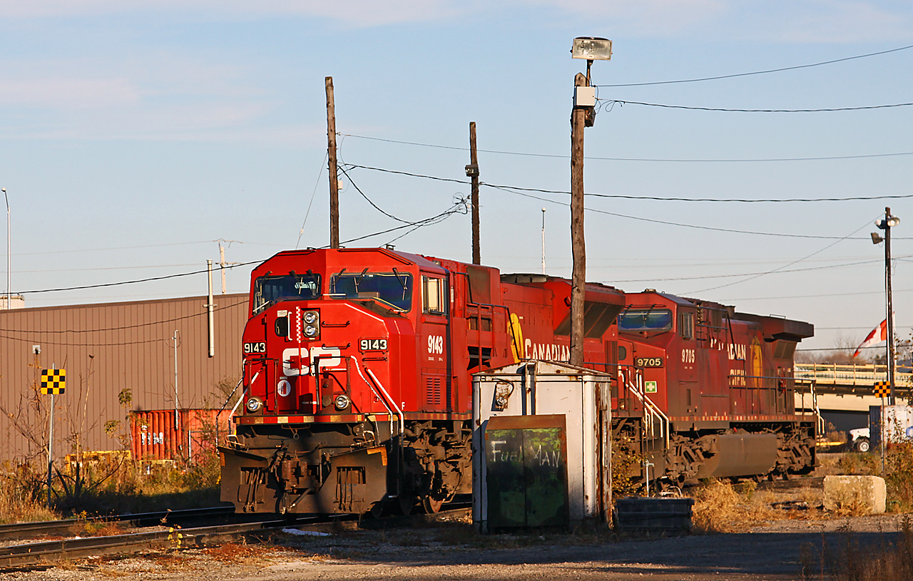 One of those "I'm glad I got this" shots... In a scene no longer possible for a couple of reasons, we find CP 9143 on the Quebec Street shop track with AC4400CW #9705. Not only have the SD90's been parked and put up for sale, but the track that the engines are resting on has recently been removed. Now seldom used, it was not that long ago that finding the London Pickup power, the Ham Turn power, or the yard geeps tied down (often all together) on the shop tracks. The remaining shop track is now primarily used for fueling engines or performing minor mechanical work while in transit.