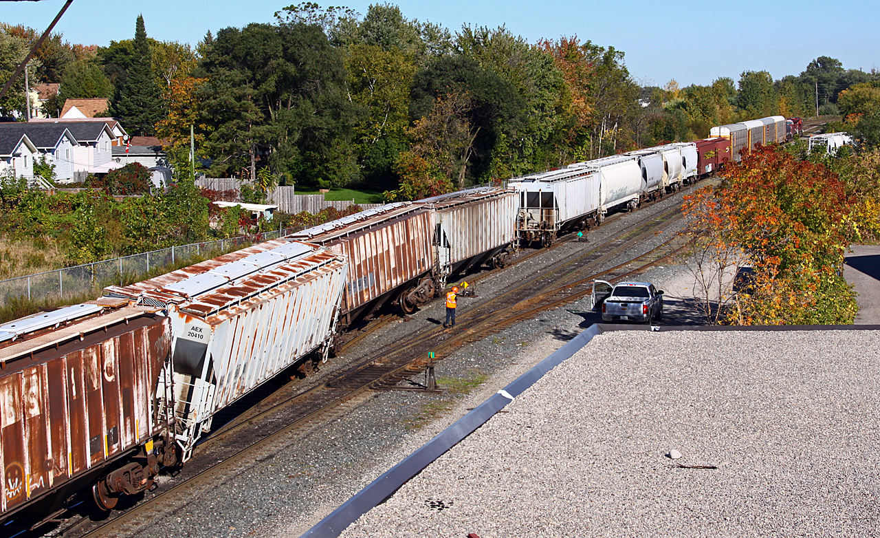 Ever have one of those days? Just before the long weekend, of course, CP 254's train had a little oops moment in the yard at CP Quebec Street. The inbound crew had just made their setoff and the outbound crew was making the lift when an empty hopper picked the yard lead/#2 track crossover, taking a couple other cars with it. Not only did it cause a bit of confusion for CP, but also for vehicle traffic on Adelaide street while the yard job (TL-11) made several moves to swing the rear of the train onto the passing track (across the grade crossing) so that 254 could continue eastward. And to add insult to injury, the lead engine was having computer problems...
