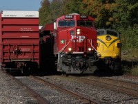 Old meets new. CP 147, with relatively new CP 9364 on the point, charges past the derelict OSR F unit with it's train, which was waiting for 147 to pass to head into Coakley siding.