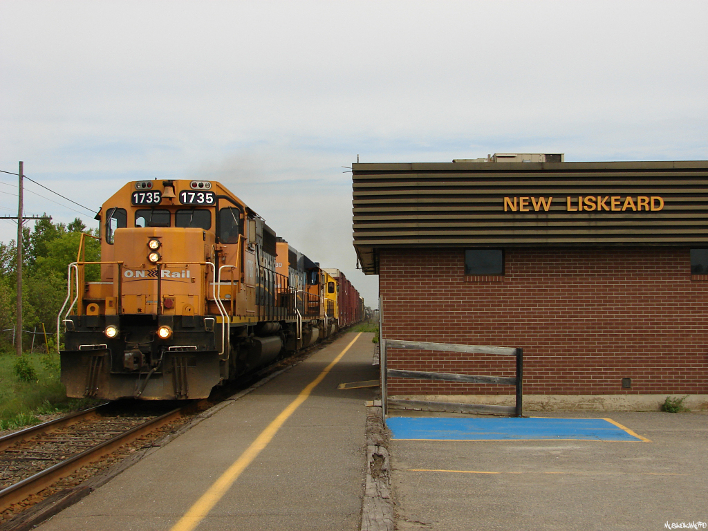 ONT 214 - ONT 1735 South highballs through downtown New Liskeard, North Bay bound.