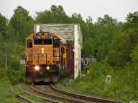 ONT 214 - ONT 1735 South hammers over the impressive trestle that spans the Latchford dam, an interchange for the Montreal river, with 62 cars in tow for connection with CN at North Bay. 