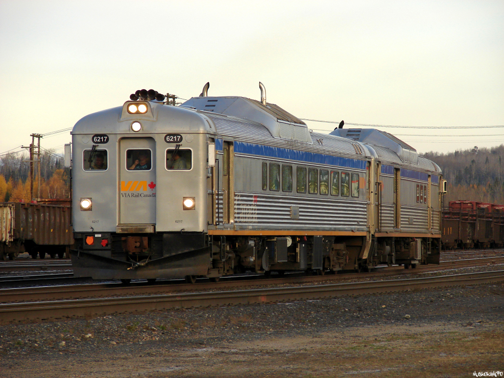 VIA 6217 East departs White River with train 86V-25 to Sudbury shortly after sunrise on time with VIA 6217 and VIA 6250 out of the passing track.