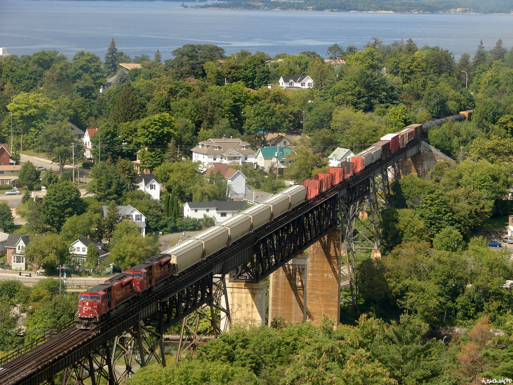 CP 9120 South with train 222-07 from Winnipeg back on the move after getting nailed by the hotbox detector at mile 26 with 4 separate alarms. Seeing trains Southwards on this trestle is rare enough these days due to a directional running zone with CN, and now 5 years later it's impossible to see either of these SD9043MAC's (CP 9120 and CP 9114) as they're all mothballed and were for sale in Winnipeg, but are not currently listed on CPR's surplus assets for sale page facing an uncertain future.