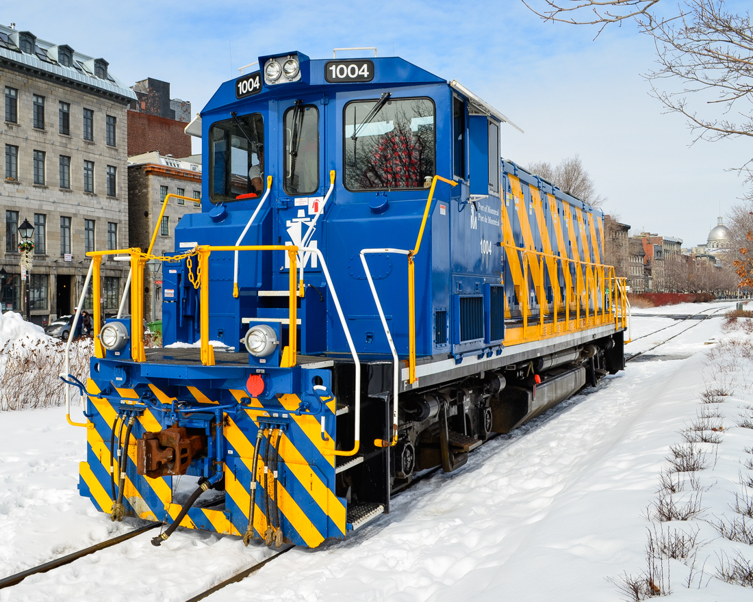 A face only a mother could love. You've heard of chop nosed locomotives.... Well say hello to a no nose locomotive! On their second order of RP20BD's, the Port of Montreal specified this nose design, which differs from their first order which had a more conventional nose. Here POM 1004 is stopped to participate in the Old Port Symphony, which involves boats, trains and church bells making a lot of noise, an annual event. For more train photos, check out http://www.flickr.com/photos/mtlwestrailfan/