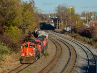 <b>Quad GP9's.</b> Four GP9's (CN 4102, CN 7275, CN 7017 & CN 7031) are in charge of CN 527 today, operating on the transfer track. This track has primarily been used for storage of cars the past few years, but since CN cleared the growth from this track a month ago, there has been an increase in traffic on it. For more train photos, check out http://www.flickr.com/photos/mtlwestrailfan/