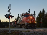 A five-unit lashup (CN 2245, CN 2232, CN 2685, CN 8873 & CN 2323, not all powered) heads north through CN's remote and scenic Lac St-Jean sub. The sun is just rising and unfortunately this will be the last place to photograph this train as it will soon enter and even more remote part of Quebec with few grade crossings. For more train photos, check out http://www.flickr.com/photos/mtlwestrailfan/