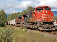 CN 8851 is the lead unit on this eastbound mixed freight as it approaches the crossing @Clearwater.