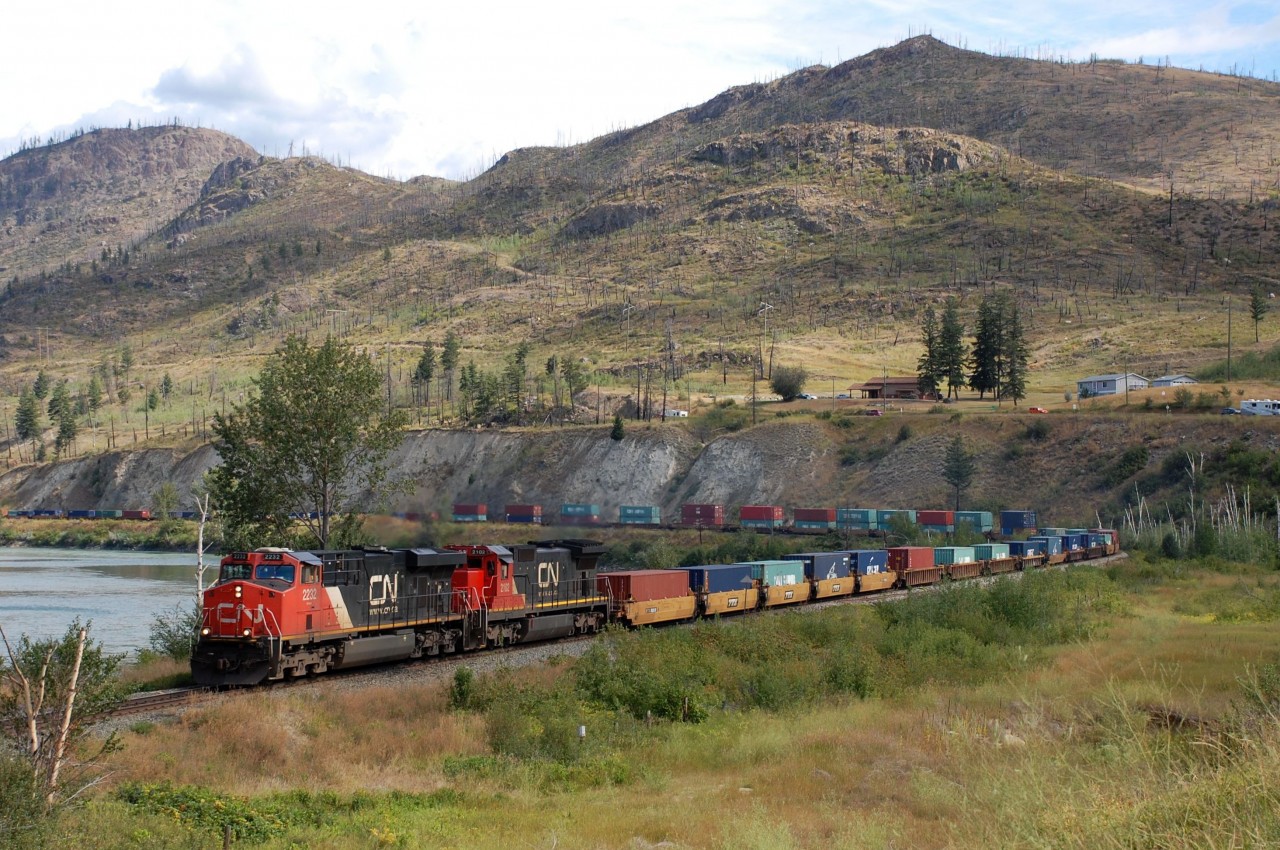 10yrs after the Barriere wildfire the hills are still bare. CN nos.2232&2102 are at the head of a westbound Intermodal just south of the town.