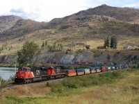 10yrs after the Barriere wildfire the hills are still bare. CN nos.2232&2102 are at the head of a westbound Intermodal just south of the town.