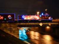 <b>Last year's holiday train.</b> CP 9815 pushes the deadheading 2012 CP holiday train over 55th avenue in Lachine. It was temporarily heading east towards St-Luc Yard after being on display at Beaconsfield. The next day it would head west across Canada. For more train photos, check out http://www.flickr.com/photos/mtlwestrailfan/