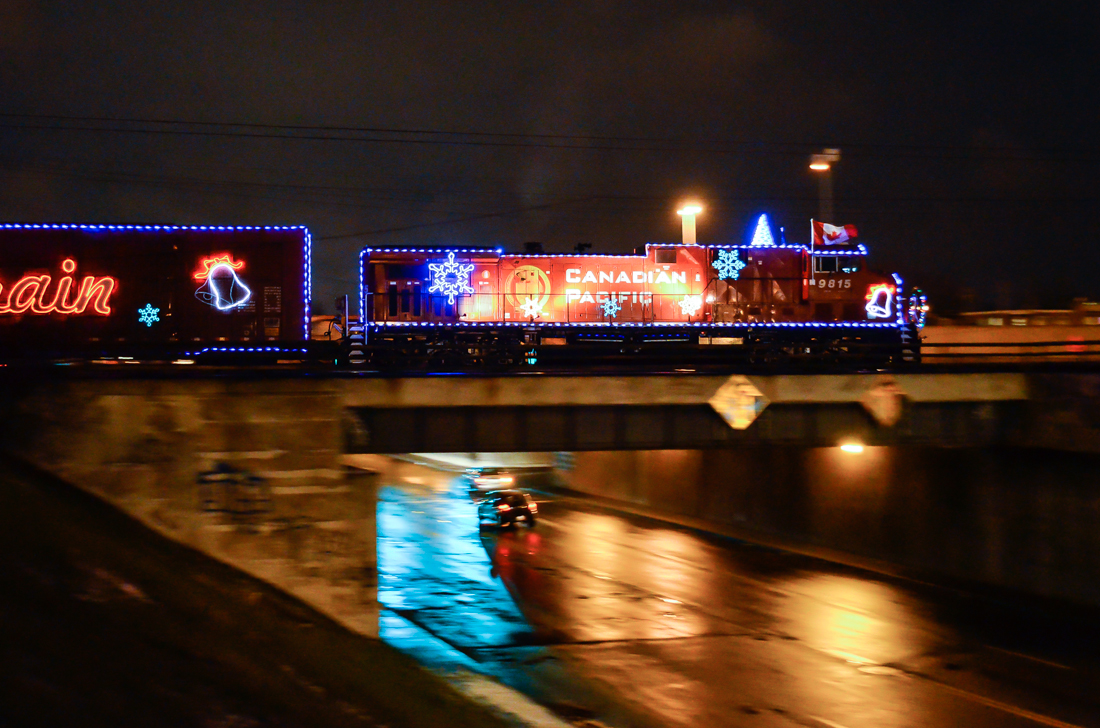 Last year's holiday train. CP 9815 pushes the deadheading 2012 CP holiday train over 55th avenue in Lachine. It was temporarily heading east towards St-Luc Yard after being on display at Beaconsfield. The next day it would head west across Canada. For more train photos, check out http://www.flickr.com/photos/mtlwestrailfan/