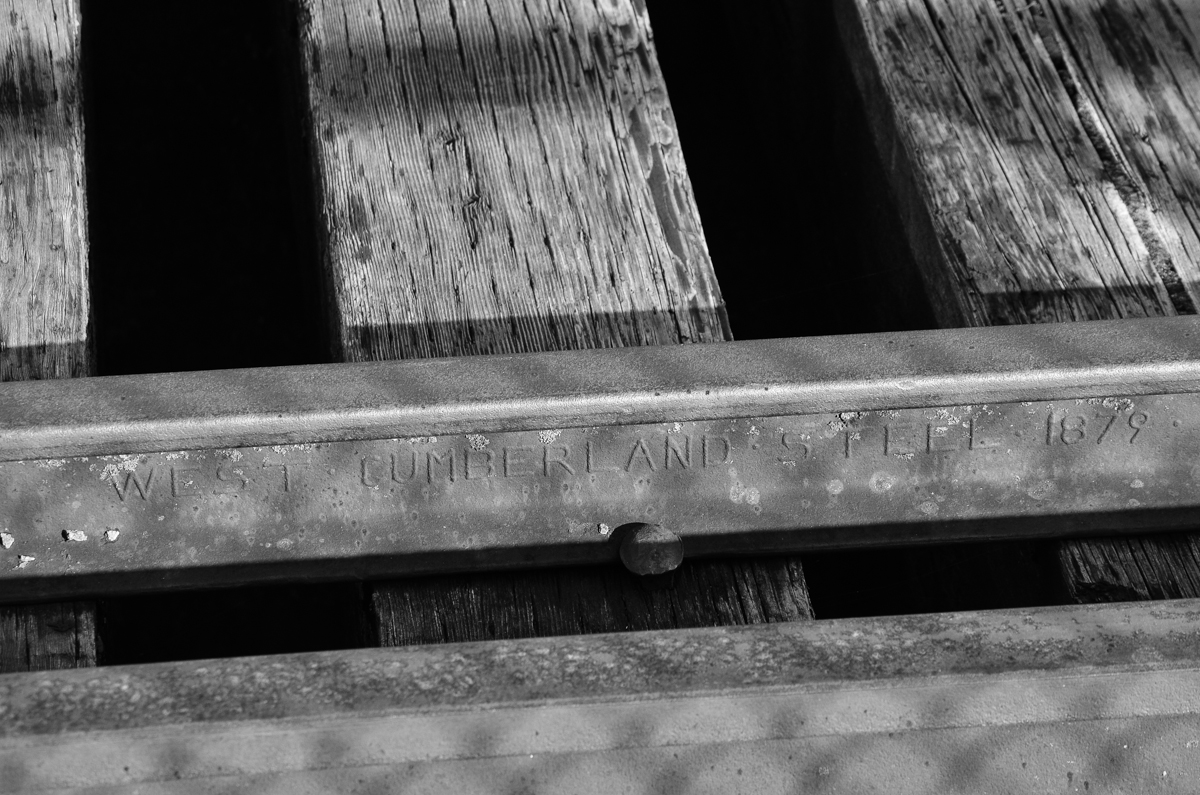 134 year old rail. This rail is on the gauntlet track on a bridge over the Missisquoi river on MMA's Stanbridge Sub in Bedford, Qc. The main rail is from the 1920s/30s. This bridge was constructed in 1879 by the South Eastern Railway, a CP predecessor, so this gauntlet rail has never been changed. The whole subdivision including the bridge was in use until a couple of months ago; it is out of service now at Transport Canada's orders until the condition of the whole line is improved. For more train photos, check out http://www.flickr.com/photos/mtlwestrailfan/
