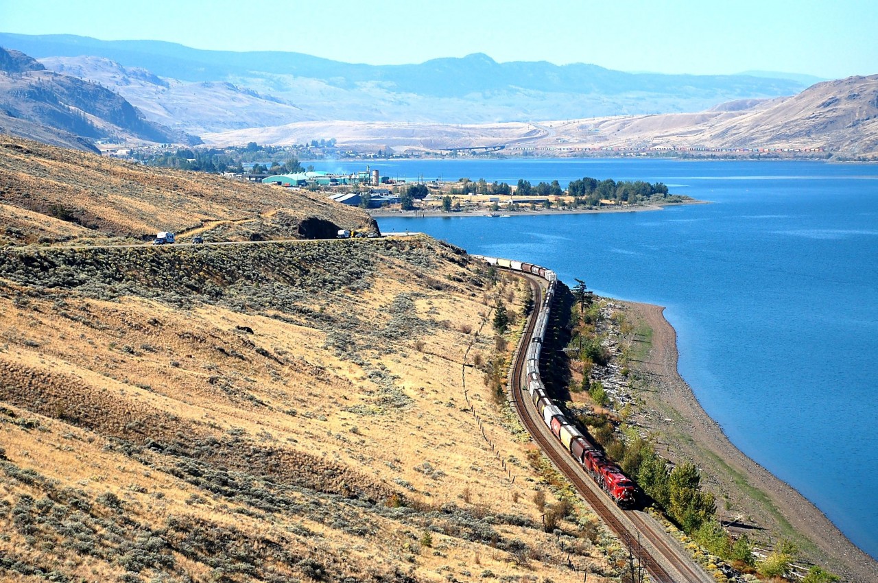 Looking westwards towards Savona and the Thompson Valley as CP nos.9352&9823 bring an empty grain train alongside Kamloops Lake. A CN train can be seen heading west on the other side of the lake(upper right).