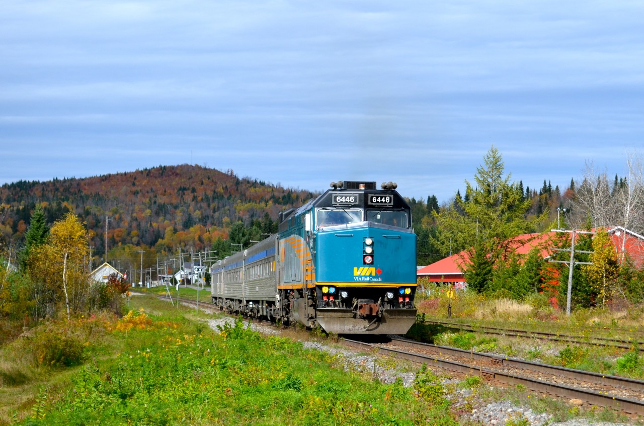 VIA's train from Jonquière in northern Quebec has just made its station stop at Rivière-à-Pierre and is heading south again. The train consists of VIA 6446 followed by two stainless steel coaches and a baggage car. The power is turned at Jonquière on a turntable, but the cars are not turned, hence the baggage car at the rear end. For more train photos, check out http://www.flickr.com/photos/mtlwestrailfan/